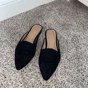 Black pointed toe slip on black flats